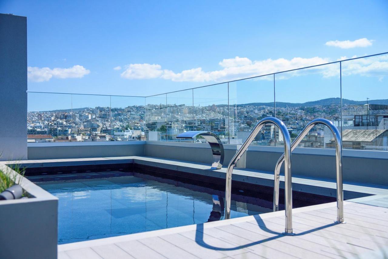 Onoma Hotel Thessaloniki Exterior foto A pool with a glass balustrade